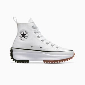 White/black/gum Converse platform hightops.